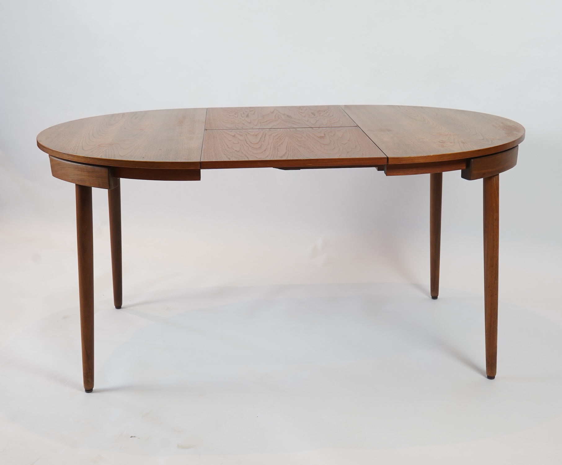 Hans Olsen (Danish, 1919–1992) for Frem Røjle: A Danish teak 'Roundette' extending dining table and four chairs